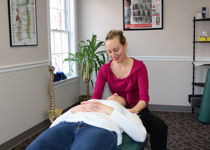 Frederick chiropractor educates patient about posture