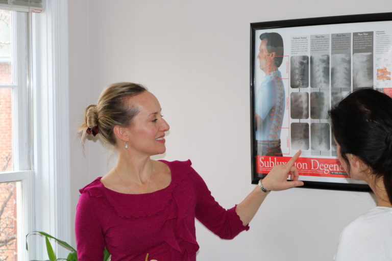 Frederick chiropractor educates patient about posture
